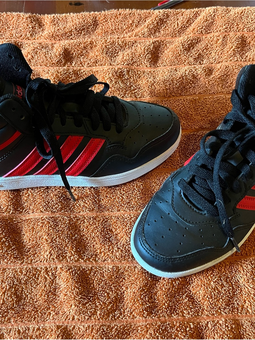 Black and Red High-Top kids Adidas sneakers 4y